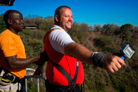 Bungee Jumping at Victoria Falls. Even though we never entertained the thought of doing this, we literally witnessed people doing the big dive from the Livingstone Memorial Bridge. Even though we seemed to be some distance away in Zimbabwe's walkways, we could still hear the screams of bungy jumpers through the background noise of Victoria Falls thundering in the background. I have to believe this is perhaps one of the crazier ways of seeing Victoria Falls (maybe upside down) since we could see jumpers were getting sprayed by the falls as well as being suspended seemingly within arms reach of the turbulent Zambezi River. This isn't our type of excursion, but I'm sure there are adrenaline junkies out there who live for this stuff. The original, the one and only, the must do, the ultimate thrill! 111m of Pure Adrenalin! 