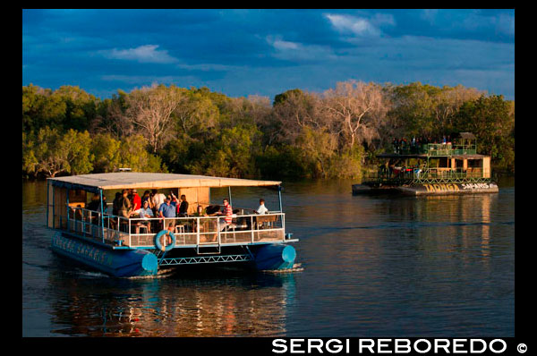 Cruise along the Victoria Falls aboard the " African Queen".  Other boats sailing in the Zambezi River. Victoria Falls is famous for its sunset booze cruises and this is a “must do” experience. But you don’t have to be an alcohol drinker to enjoy the experience of being on Southern Africa’s largest river. You are certain to see hippo and crocs and possibly elephant during the excursions, which last about two hours on average. During the dry season, elephants often swim to the islands to feed and there are a couple of pachyderms that have taken up full-time residence on the island of Kalunda opposite the jetty on the Zimbabwean side of the river. Generally, tour operators arrange for you to be picked up from the hotel, lodge or B&B, and driven to one of the many launch sites along the western bank of the Zambezi. From the Zimbabwe side, the ride out to the boarding points varies depending on where you are staying and how many pick-ups the drivers have to make, but generally the wait is not more than 10 to 15 minutes. From the Zambian side, boats tend to depart from hotel docks. 