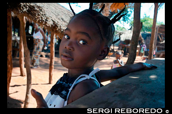 A girl with braids in Mukuni Village. The Mikuni Village is about 30 minutes from Livingstone, home to approximately 1100 Leya people. It's a very peaceful, civil, and clean village founded in the 13th century. We strolled throughout the village, learning about how they live, work, and commune with one another. They build their own tools, crafts, and homes. Their crafts are sold at the end of the village tours where you really have to spice up your bargaining skill! Mukuni Village is an authentic tribal village where thousands of people live and work. In July of each year the Leya people partake in the colorful Lwiindi Ceremony. The local people believe the spirits of their ancestors still dwell in the gorges of the Falls and during the Lwiindi, they offer sacrifices to them for rain.