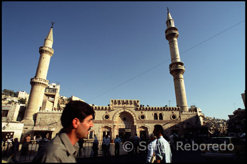 From the Nymphaeum, the short stroll to the King Hussein Mosque bustles with pedestrians, juice stands and vendors. The area around the King Hussein Mosque, also known as al-Husseini Mosque, is the heart of modern downtown Amman. The Ottoman-style mosque was rebuilt in 1924 on the site of an ancient mosque, probably also the site of the cathedral of Philadelphia. Between the al-Husseini Mosque and the Citadel is Amman’s famous gold souq, which features row after row of glittering gold treasures. To the northeast stands the small theater, or Odeon, which is still being restored. Built at about the same time as the Roman theater, this intimate 500-seat theater is used now as it was in Roman times, for musical concerts. Archaeologists think that the building was originally covered with a wooden or temporary tent roof to shield performers and audiences from the elements. Heading southwest from the theater complex, Philadelphia’s chief fountain, or Nymphaeum, stands with its back to Quraysh Street. Much of the fountain, which was completed in 191 CE, is hidden from public view by private houses and shops. The Nymphaeum is believed to have contained a 600 square meter pool, three meters deep, which was continuously refilled with fresh water. Jordan’s Department of Antiquities is currently excavating the Nymphaeum, and ultimately hopes to restore the site to its original structure by 2010.