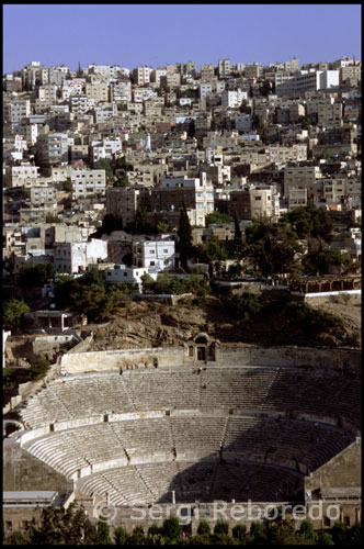 The theatre was built during the reign of Antonius Pius (138-161 CE). The large and steeply raked structure could seat about 6,000 people: built into the hillside, it was oriented north to keep the sun off the spectators. It was divided into three horizontal sections (diazomata). Side entrances (paradoi) existed at ground level, one leading to the orchestra and the other to the stage. Rooms behind these entrances now house the Jordanian Museum of Popular Traditions on the one side, and the Amman Folklore Museum on the other side. The highest section of seats in a theatre was (and still is) called “The Gods”. Although far from the stage, even there the sightlines are excellent, and the actors could be clearly heard, owing to the steepness of the cavea.