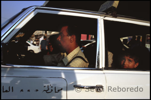 Yellow and grey taxis are readily available and can be easily found anywhere in Amman. Taxis for Amman will have a green logo on the driver and passenger doors. The grey ones have an advertisement on top of the car. Resist hailing cabs with another color logo; these cabs are based in other cities and it is illegal for them to pick up fares in Amman. Taxis in Amman are required by law to use meters and most drivers will reset the meter as soon as a fare is picked up. Most trips within Amman should be under JD5. Taxis are not required to use meters after midnight and drivers often expect double the normal fare for late night trips. The base rate for the taxi meter was changed recently from 150 fills (JD 0.150) to 250 fills (JD 0.250) due to the rising oil prices, however, not all taxis have replaced their old meters with new ones, and when a taxi is using an old meter, it is legitimate for the driver to ask you for 10 extra piasters on top of the quoted meter fare. Make sure though that you note the initial fare as soon as the driver turns the meter on in order not to have the driver ask you for "the 10 piasters" when he has a new meter. Drivers are not normally tipped, instead the fare is simply rounded up to the nearest 5 or 10 piasters. It should be noted that many drivers do not carry much change, so exact change should be given when possible. The going rate for a taxi from Amman to the airport is JD35, although some drivers can be talked down to JD30. If you are visiting the Citadel, call it al'Aqal. The driver may try to convince you that the Roman theater is nicer so that he can drop you off there at the bottom of the hill. It's best to be dropped off at the Citadel and walk down the hill to the Roman theater.