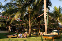 Tourists take in the sun one of the many hotels in Legian. Bali.