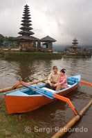 A couple of wedding photos done in a boat on the lake next to the Brat important temple Pura Ulan Danu Brat. Central mountains of Bali.