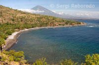 The small fishing village of Amed background with views of Mount Gunung Agung (3142m). East of Bali.