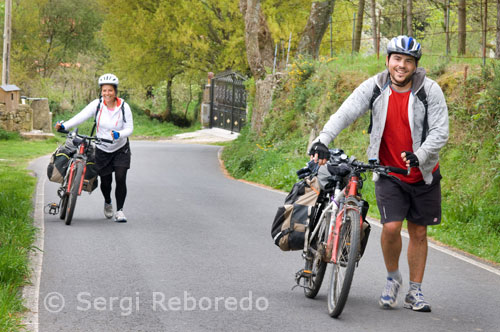 A couple made the Camino de Santiago by bike. Outskirts of Santiago.