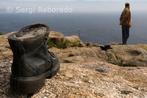 A boot-shaped sculpture pays homage to the pilgrims at the Lighthouse Fisterra.