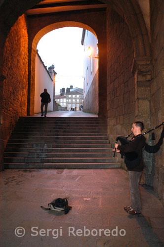Playing the bagpipes in the old town of Santiago de Compostela.