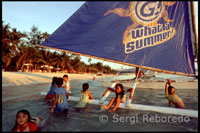 Boat sailing. Children playing. White beach. Boracay. 