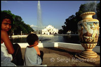 Some children play in the fountain of Plaza Salcedo. Cathedral of Saint Paul. Vigan. Ilocos.