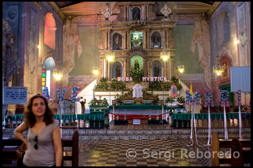 One of the oldest church buildings in the history of the Philippines is the Baclayon Church. It is an interesting spot if you want to learn things about the early history of the Philippines especially during the era of Spanish occupation. We’ll look into the history of the Baclayon Church, and perhaps find a religious heritage.The Baclayon Church is the oldest Catholic stone church building in the Philippines. It was constructed during the Spanish occupation and the first Spanish missionaries (called doctrineros) settled in the area in the late 15th century. Today you can still see the original stone structure of the Baclayon Church in the City of Tagbilaran, Bohol, Philippines. There are other preserved church buildings in the region but the Baclayon Church is the best preserved among them. The church itself is Jesuit, but the Baclayon Church (the one we see today) was completed in 1727. The erected church building known today as the Baclayon Church is formally known as The Church of Our Lady of the Immaculate Conception. The area where the Baclayon Church now stands was home to the Spanish Jesuit missionaries when they arrived in the Philippines. The Jesuits were forced to leave and move their headquarters to Loboc. This was due to fears of being mobbed by Moro marauders. In 1717 Baclayon was raised to the status of a parish. Thus construction on a new church (the Baclayon Church of today) began. The construction of the Baclayon Church required two hundred native laborers who were forced to do the work. These artisans hauled coral stones from the sea, then skillfully cut them into square blocks, lifted the work using bamboo to move the stones into position, and piled them like bricks. About a million egg whites were used to cement the cut coral stones together. This was a testament to the great skill of these native artisans. The Baclayon Church was completed in 1727 and a large bell was added in 1835. The church building had a dungeon where violators of Roman Catholic Law were punished. Filipino natives were its usual occupants.The attractions we’ll see in the Baclayon Church include an old convent with a small museum. There you’ll see some centuries-old relics. Most artifacts you’ll see in the Baclayon Church museum are religious in nature. Antiquities of note are an ivory statue of Jesus Christ dating back to the 16th century, a statue of the Virgin Mary, St. Ignatius of Loyola’s relics, gold embroidered church vestments, a host of books and hymnals, and 1859 paintings of Liberato Gatchalian (famous Filipino painter). Traveling to Baclayon Church usually takes a boat ride to the Tubigon Port using the RORO water ways system. From there you can take the air-conditioned tour vans (highly recommended because of the rough dusty roads you’ll have to cover). The fare for the van would cost about Php 2,500. You better know your roads (or get a driver who does) if you plan to drive to Baclayon Church. You will have to take the Bohol coastal road (fastest route). You’ll be going through several towns and head due east about six kilometers of Tagbilaran City (pretty tough drive if you don’t know the area). 