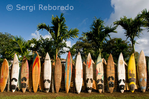 Gate decorated with surfboards. I smell. Maui.