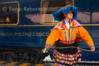 Musicians and dancers in costumes typical hosts entry in the Hiram Bingham train Orient Express which runs between Cuzco and Machu Picchu.