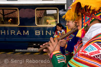 Musicians and dancers in costumes typical hosts entry in the Hiram Bingham train Orient Express which runs between Cuzco and Machu Picchu. PERU
