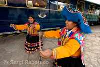 Musicians and dancers in costumes typical hosts entry in the Hiram Bingham train Orient Express which runs between Cuzco and Machu Picchu. PERU