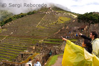 Tourists inside the archaeological complex of Machu Picchu. TURISTS IN PERU