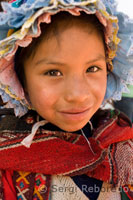 A girl dressed in traditional costume in Pisac Sunday market day. Pisac. Sacred Valley.