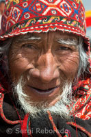 A craftsman in a traditional dress in the streets of Chinchero in the Sacred Valley near Cuzco.