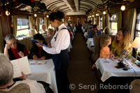 Inside the train. The waiters serve delicious food in the Andean Explorer train Orient Express which runs between Cuzco and Puno.
