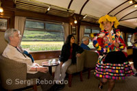 Inside the train. Musicians and costumed dancers liven up the typical journey of the Andean Explorer train Orient Express which runs between Cuzco and Puno. PERU