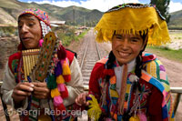 Inside the train. Musicians and costumed dancers liven up the typical journey of the Andean Explorer train Orient Express which runs between Cuzco and Puno. PERU ALTIPLANE