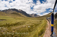 Peruvian altiplano landscape seen from inside the Andean Explorer train Orient Express which runs between Cuzco and Puno. TRAINS IN PERU