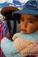 A lady with her small son at La Raya, which coincides with the highest point of the track, 4313 meters. The Andean Explorer train Orient Express runs between Cuzco and Puno.