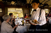 Inside the train. The waiters serve delicious food in the Andean Explorer train Orient Express which runs between Cuzco and Puno. PERU TRAINS