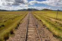 Peruvian altiplano landscape seen from inside the Andean Explorer train Orient Express which runs between Cuzco and Puno. PERU RAILWAYS